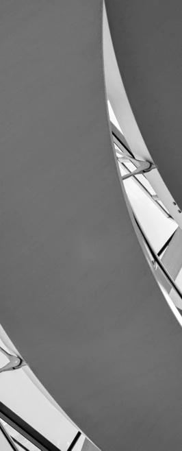 Close-up black and white abstract view of curved architectural elements in Berlin, showing light and shadow patterns. Close-up black and white abstract view of curved architectural elements in Berlin, showing light and shadow patterns.